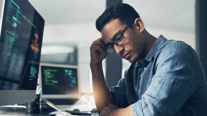A concerned medical device software developer considering the complexities of regulatory compliance
