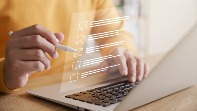 A digitally generated image of a checklist being completed on a laptop computer.