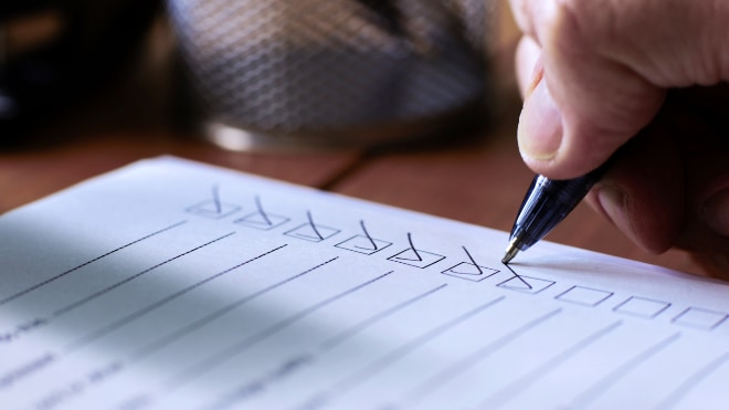 A checklist being ticket-off in pen.